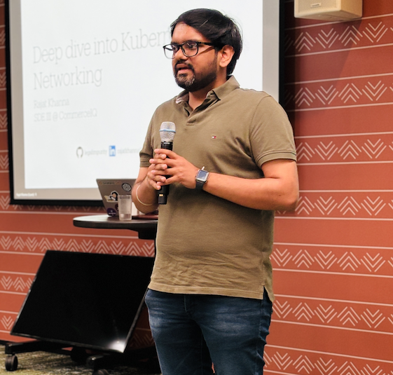 Profile Picture of Adrián Moreno (@zetxek), working side by side with a colleague: sitting on a desk, while looking at a screen